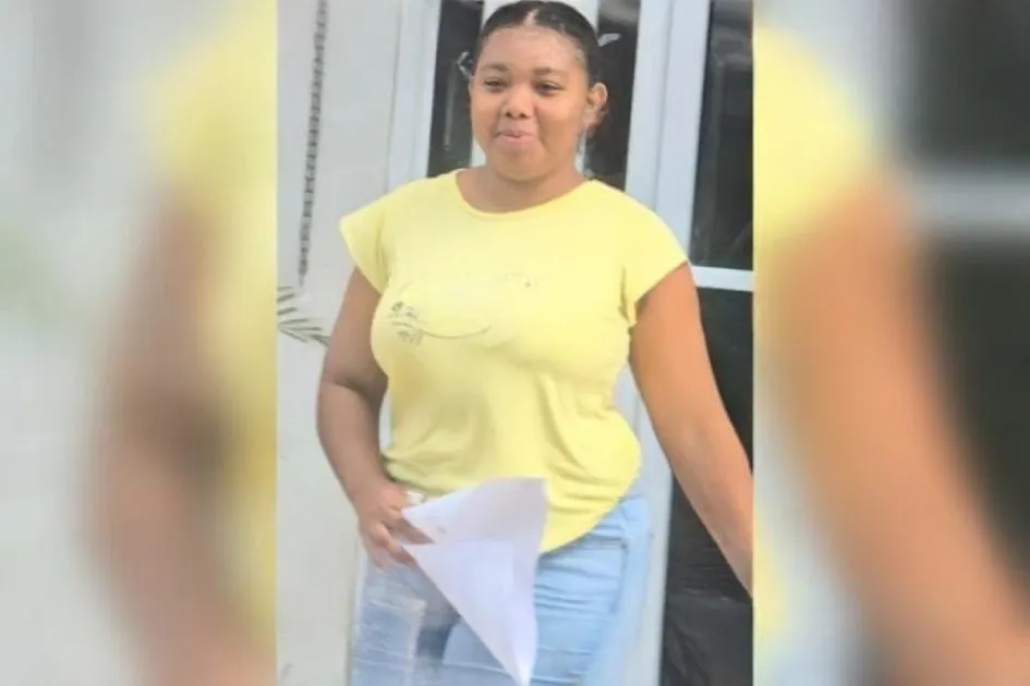 Belize woman accused of burning down house seen smiling outside court